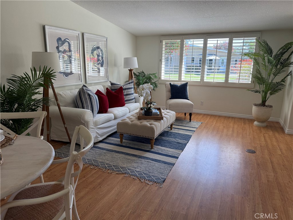 1330 Kenwood Rd M7-157f Seal Beach, CA 90740 - Photo 6 of 44 a living room with furniture and a large window