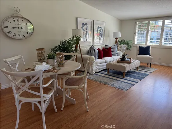 a view of a dining room with furniture window and wooden floor
