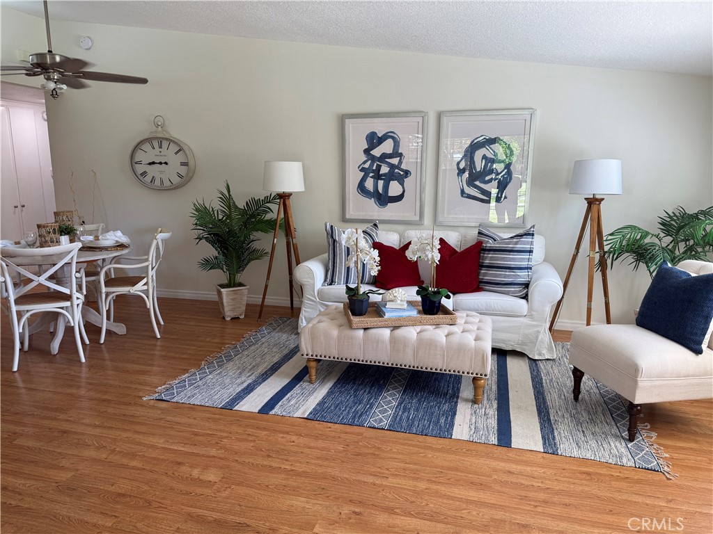 1330 Kenwood Rd M7-157f Seal Beach, CA 90740 - Photo 8 of 44 a living room with furniture or wooden floor and a rug