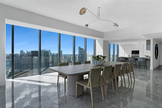 a view of a dining room with furniture window and outside view
