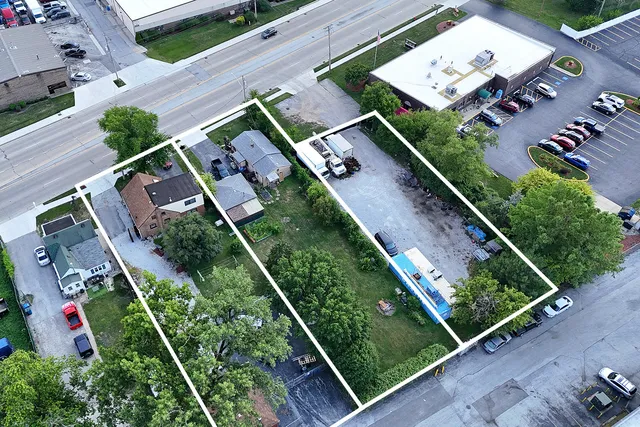 an aerial view of house with a yard