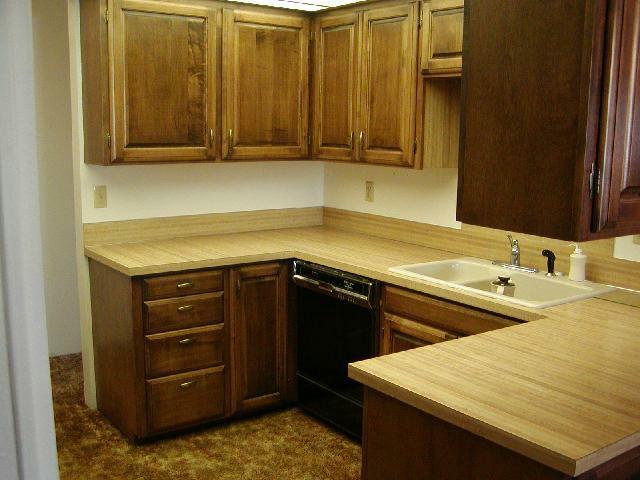 3250 Ashue Road Wapato, WA 98951 - Photo 4 of 9 a kitchen with a sink and cabinets