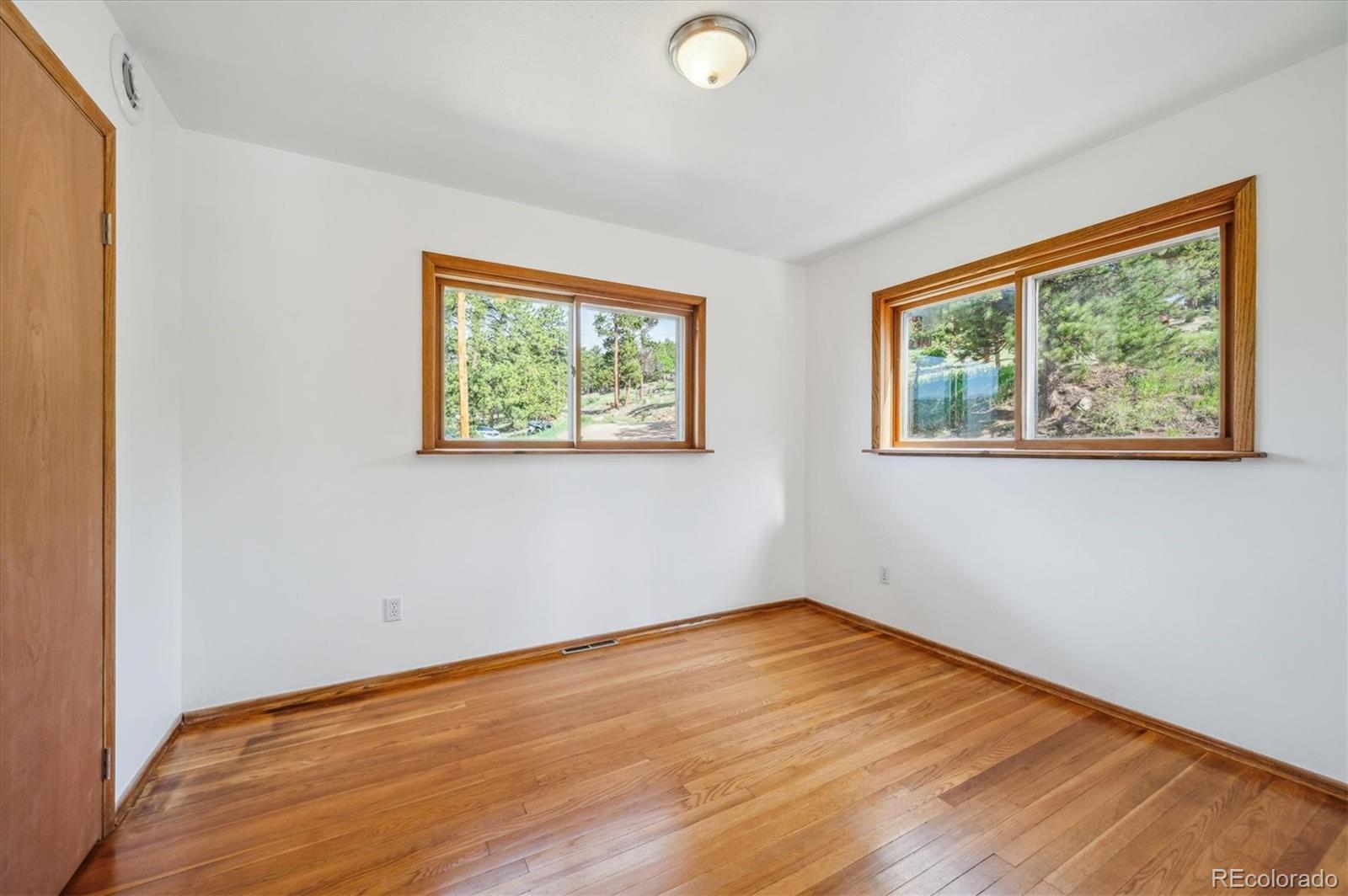 429 Overlook Drive Bailey, CO 80421 - Photo 13 of 36 a view of empty room with wooden floor