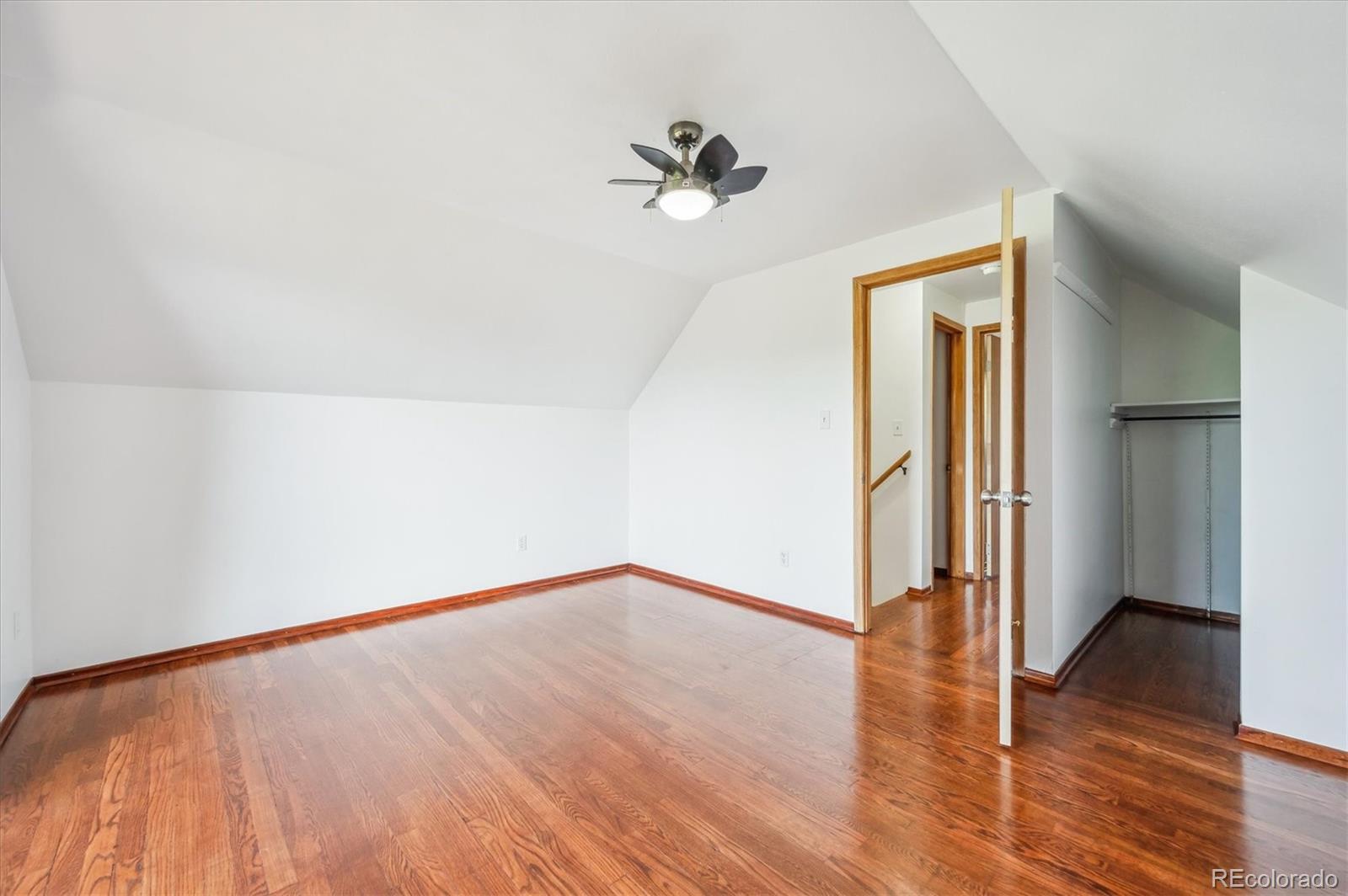 429 Overlook Drive Bailey, CO 80421 - Photo 17 of 36 a view of a room with wooden floor and a ceiling fan