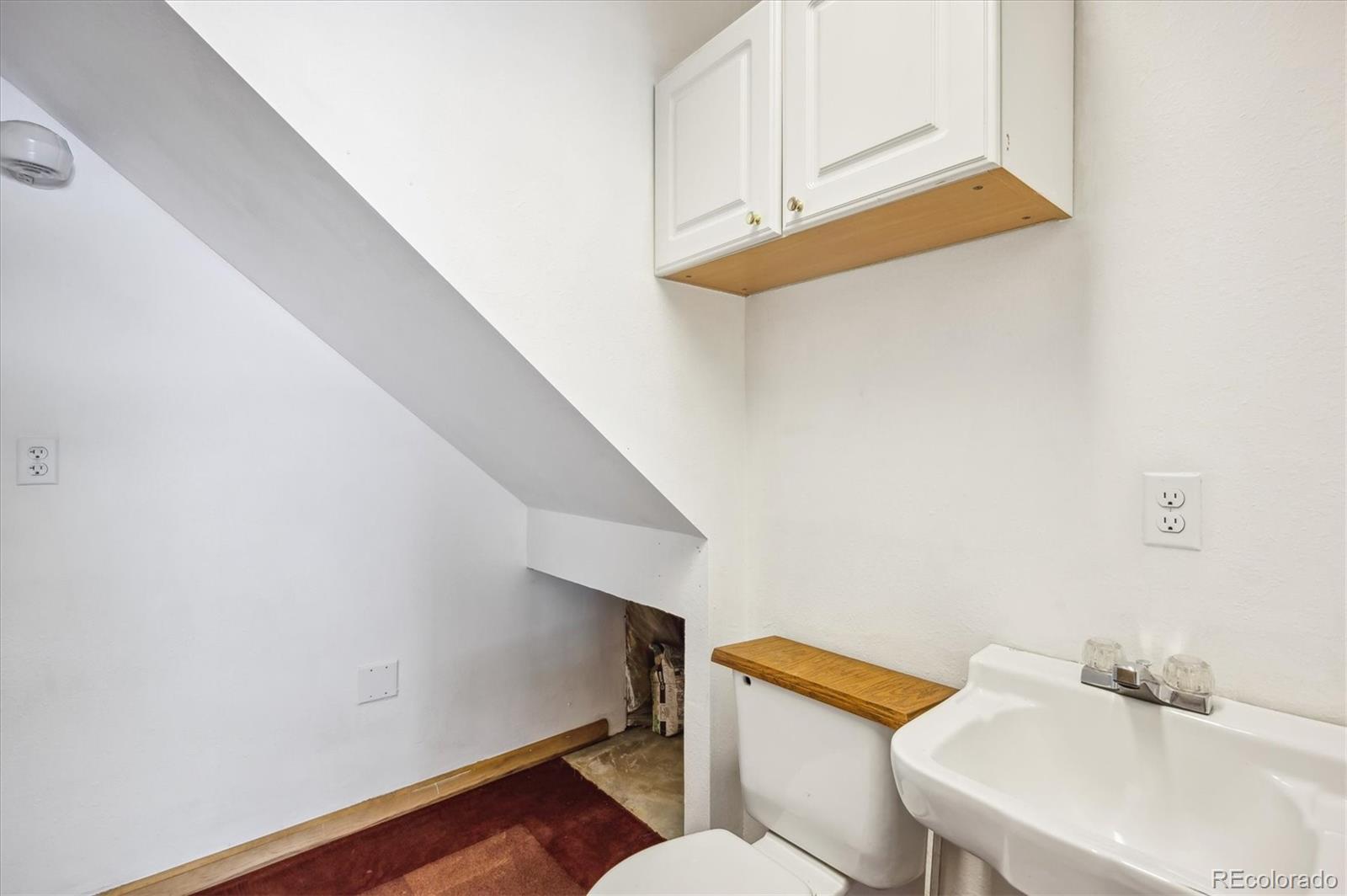 429 Overlook Drive Bailey, CO 80421 - Photo 26 of 36 a bathroom with a sink and a toilet