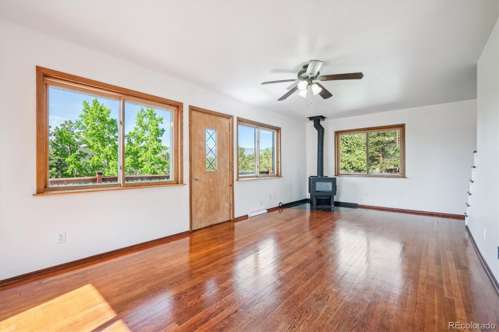 429 Overlook Drive Bailey, CO 80421 - Photo 9 of 36 a view of an empty room with wooden floor and a window