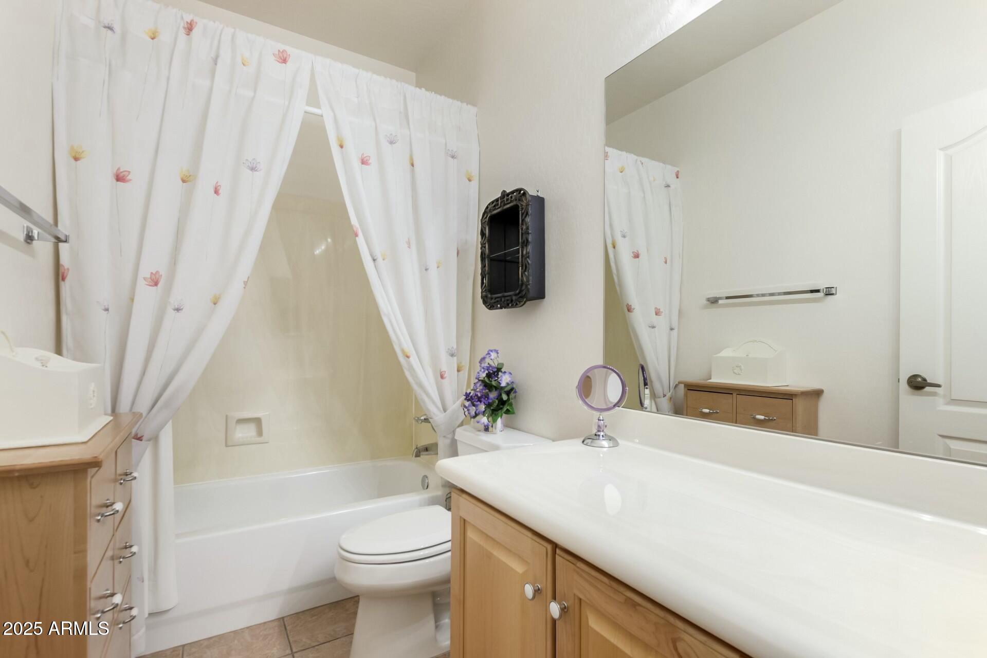 3038 West Trapanotto Road Phoenix, AZ 85086 - Photo 12 of 15 a bathroom with a sink a toilet and shower