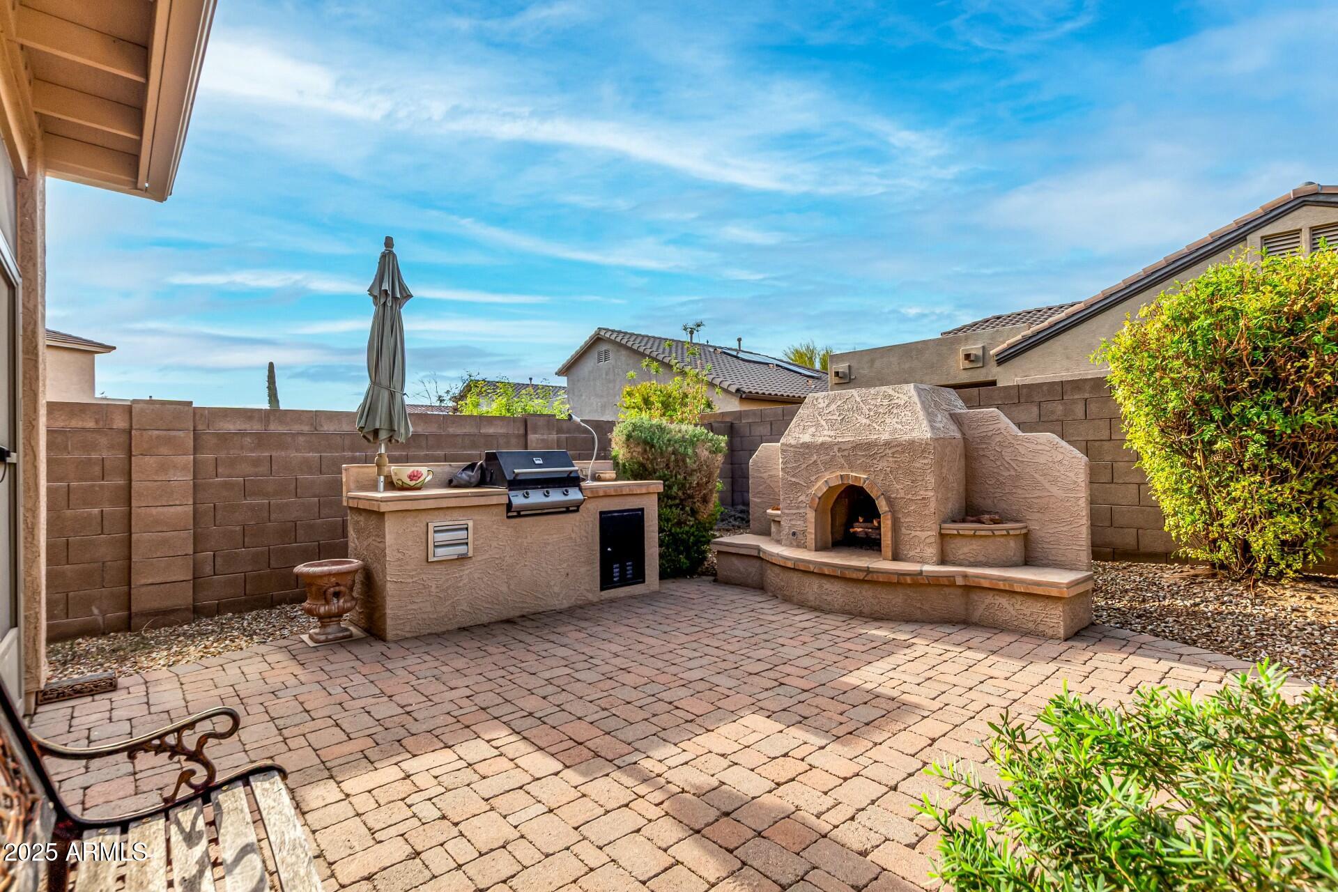 3038 West Trapanotto Road Phoenix, AZ 85086 - Photo 14 of 15 a view of a terrace with a barbeque