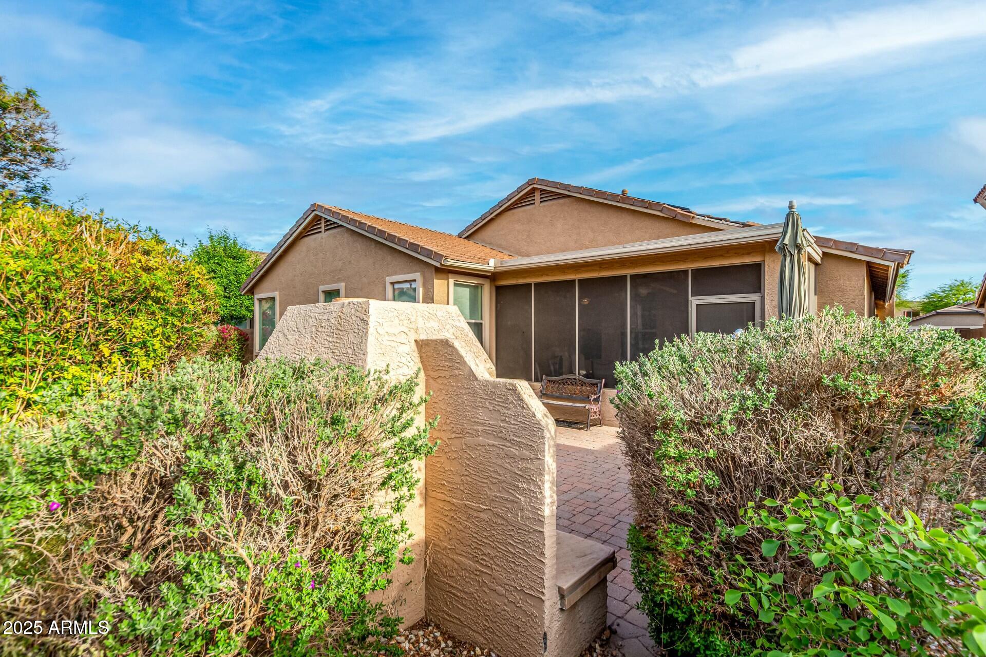 3038 West Trapanotto Road Phoenix, AZ 85086 - Photo 15 of 15 a front view of a house with a garden