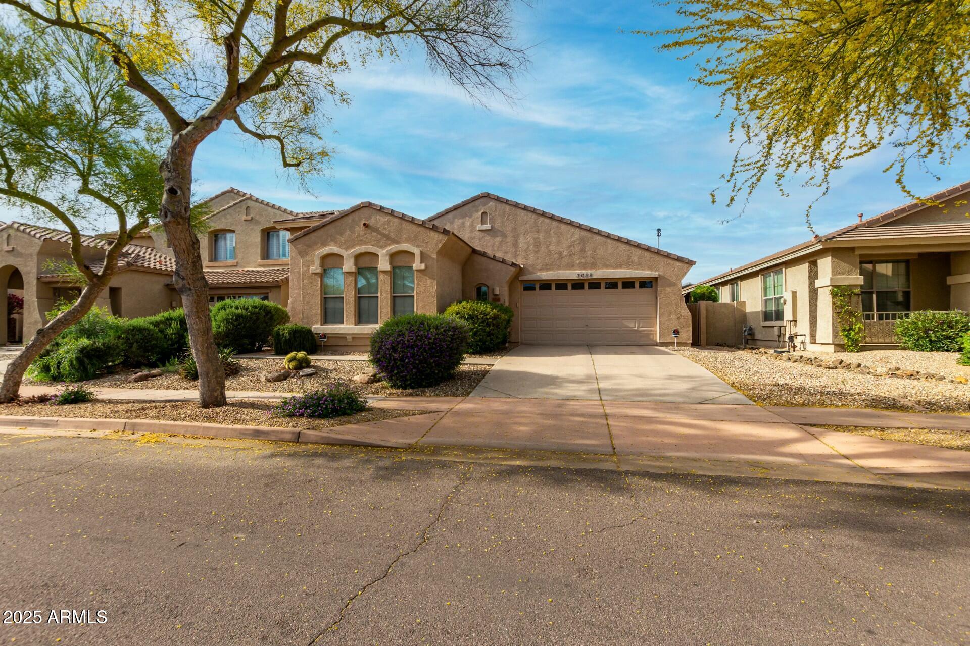3038 West Trapanotto Road Phoenix, AZ 85086 - Photo 2 of 15 a front view of a house with a yard