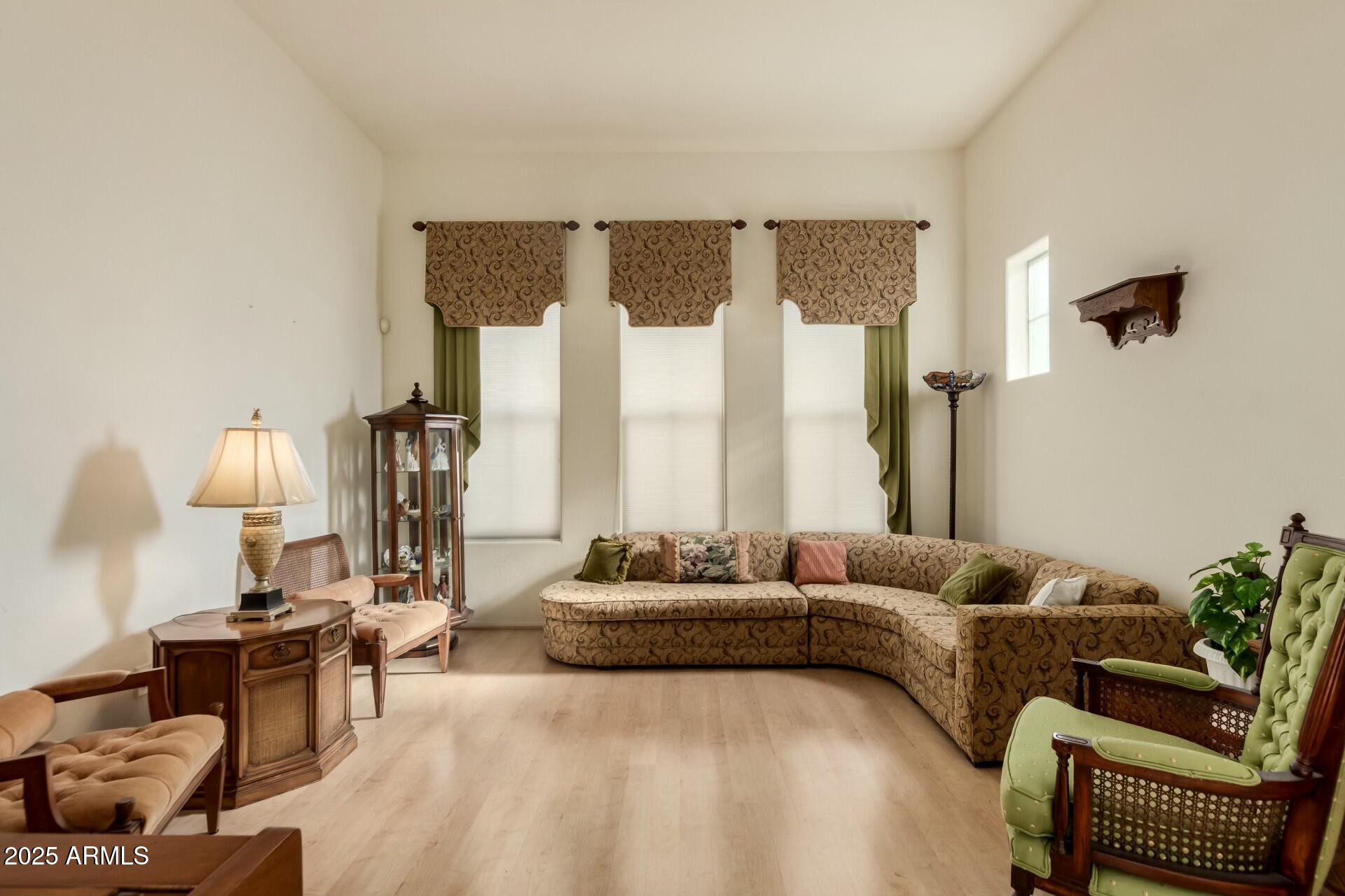 3038 West Trapanotto Road Phoenix, AZ 85086 - Photo 3 of 15 a living room with furniture and a large window