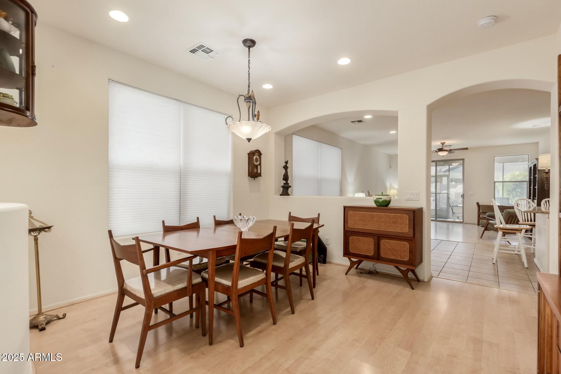 3038 West Trapanotto Road Phoenix, AZ 85086 - Photo 4 of 15 a large kitchen with a table and chairs
