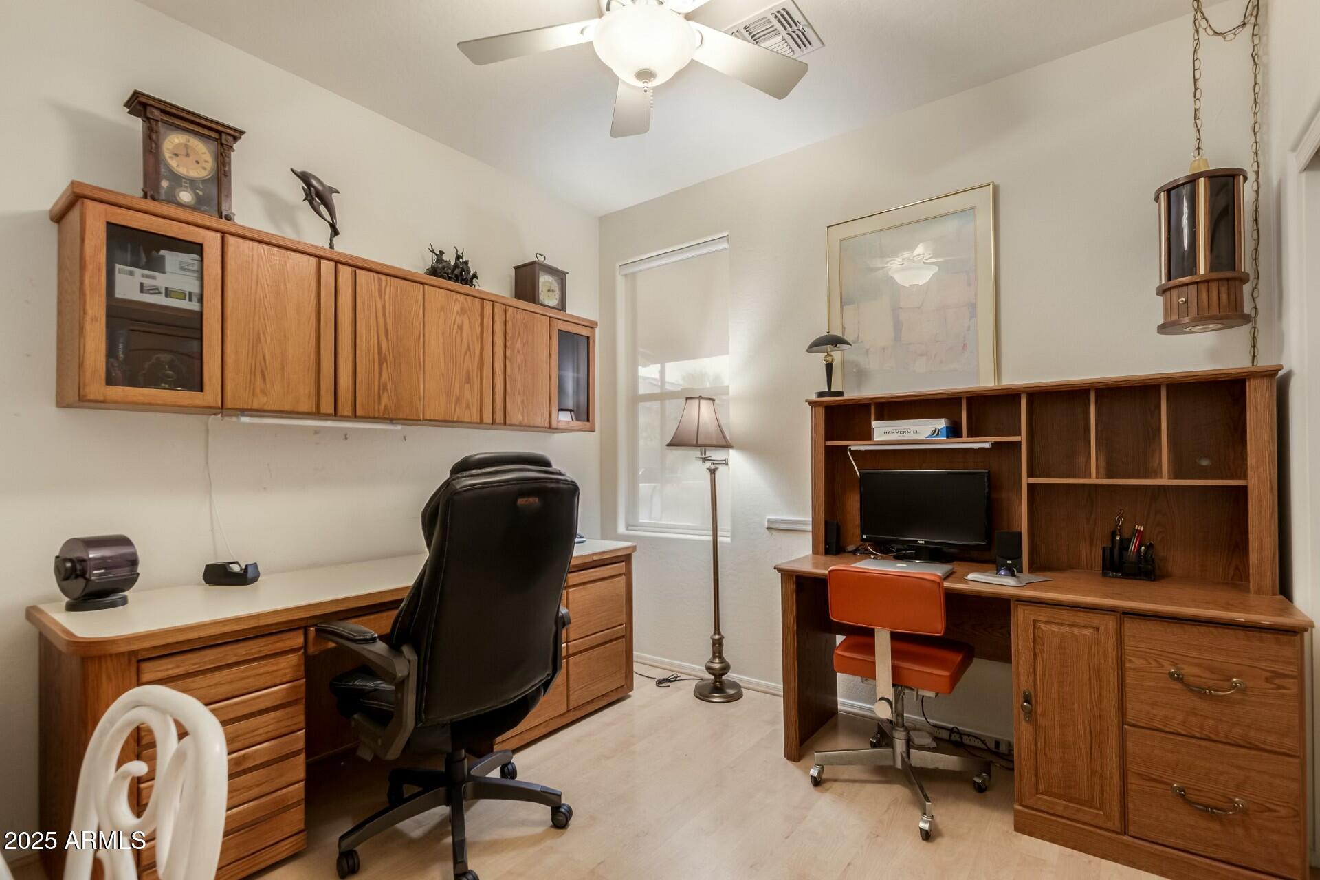 3038 West Trapanotto Road Phoenix, AZ 85086 - Photo 10 of 15 a view of a workspace with furniture and a window