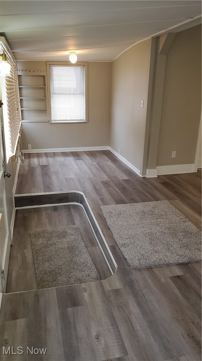 17610 Brazil Road Cleveland, OH 44119 - Photo 21 of 50 Spare room featuring dark hardwood / wood-style flooring