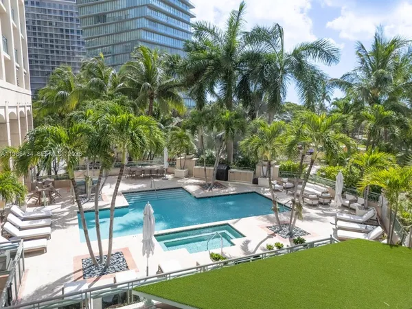 a view of a backyard with swimming pool