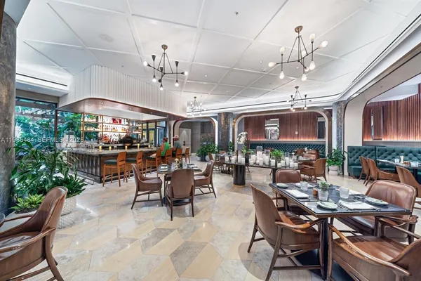 a view of a dining room with furniture window and outdoor view