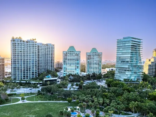 a view of a city with tall buildings in the background