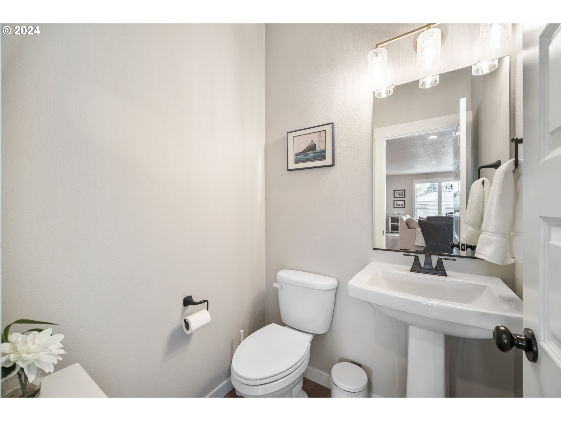 2408 South Eagle Ridge Drive Ridgefield, WA 98642 - Photo 13 of 32 a bathroom with a sink mirror vanity and toilet