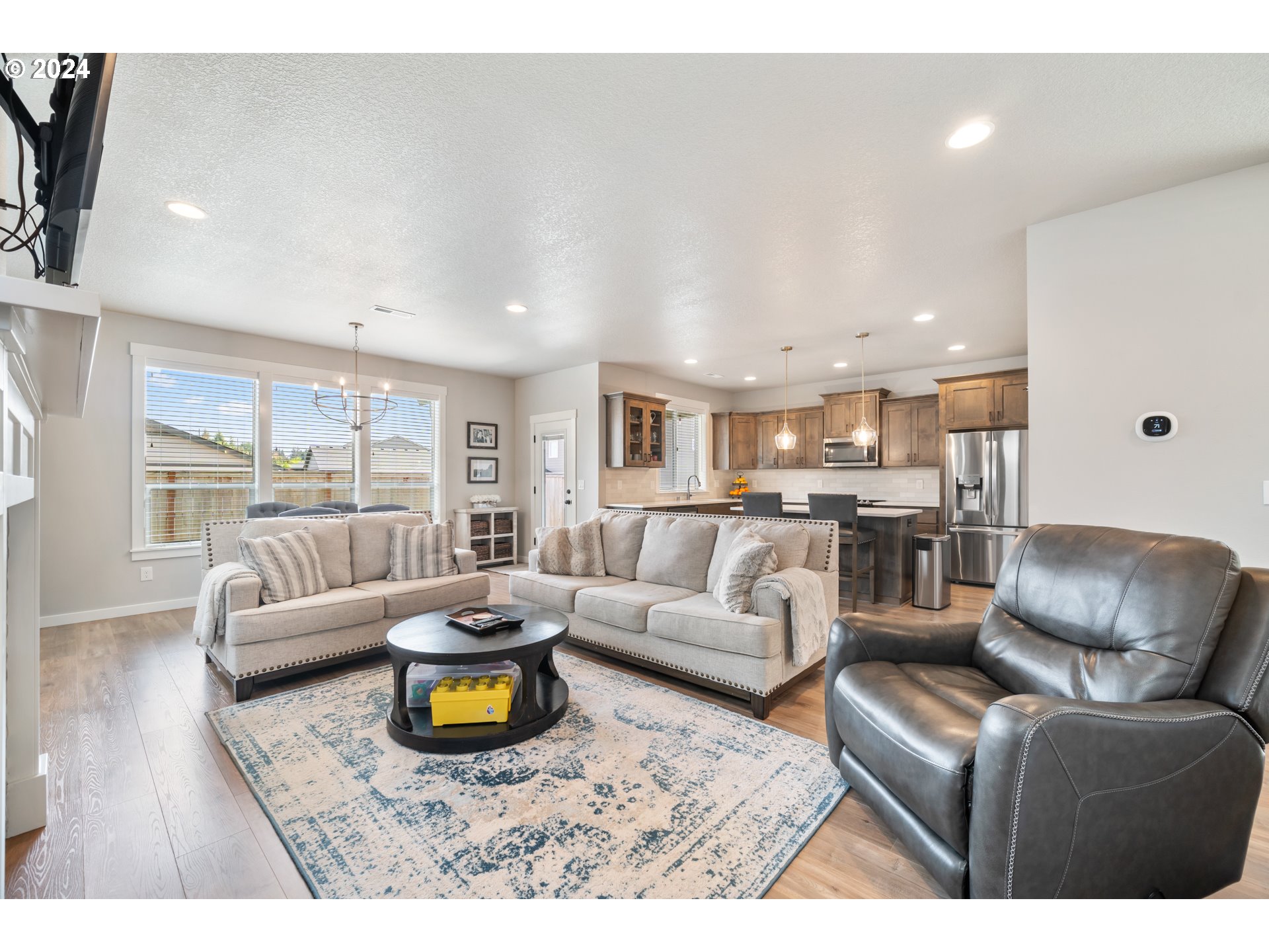 2408 South Eagle Ridge Drive Ridgefield, WA 98642 - Photo 6 of 32 a living room with furniture and a wooden floor