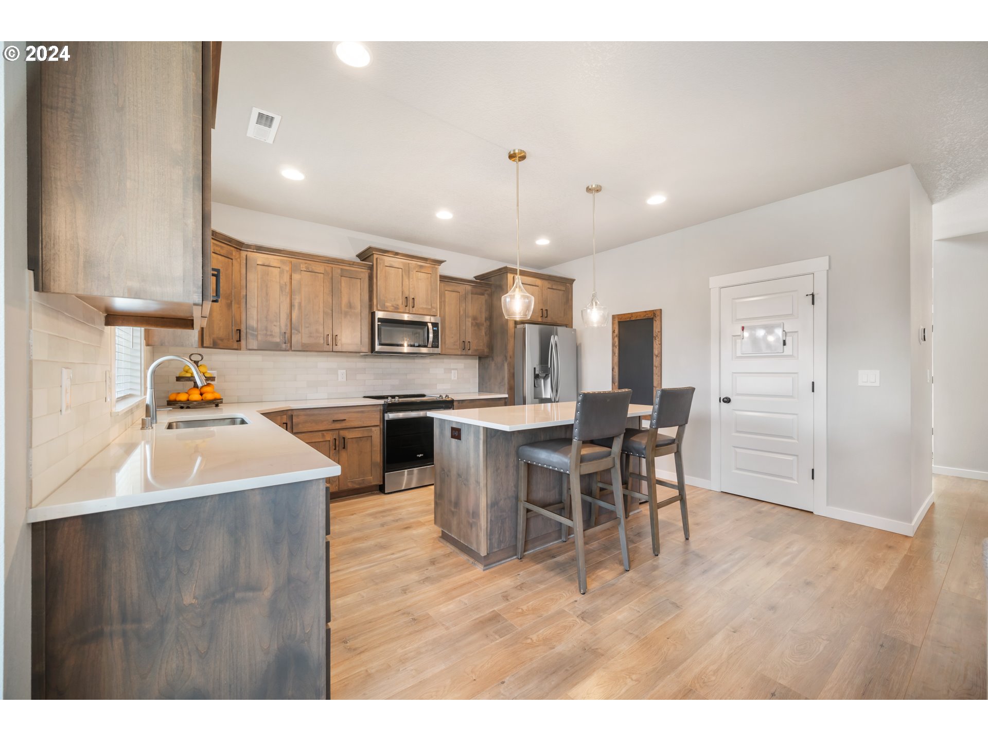 2408 South Eagle Ridge Drive Ridgefield, WA 98642 - Photo 10 of 32 a kitchen with a table and chairs in it