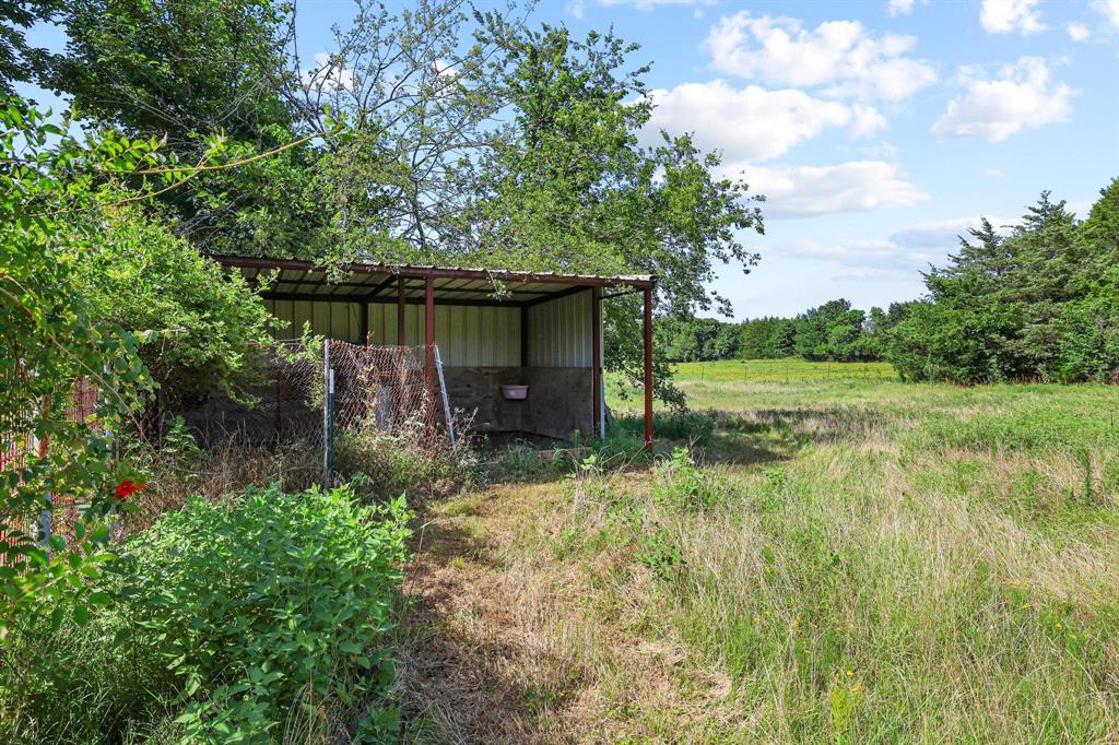252 Meadow Lake Estates Road Denison, TX 75021 - Photo 23 of 37 Nice space to store hay and horse feeders.