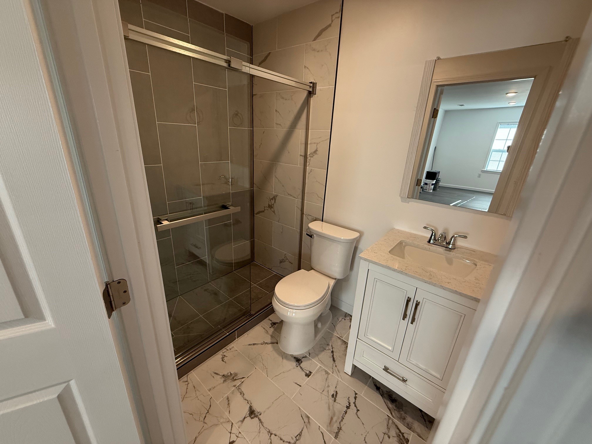 140 Phillips Street Pulaski, TN 38478 - Photo 15 of 32 a bathroom with a granite countertop sink toilet and shower