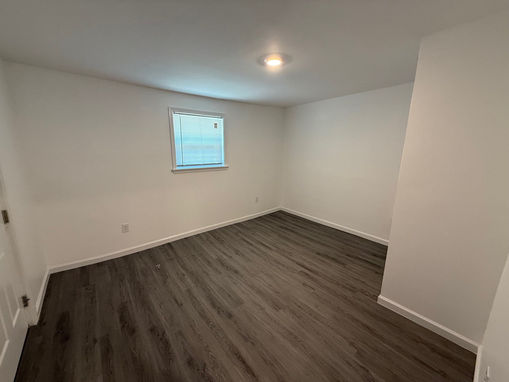 140 Phillips Street Pulaski, TN 38478 - Photo 21 of 32 a view of an empty room with wooden floor