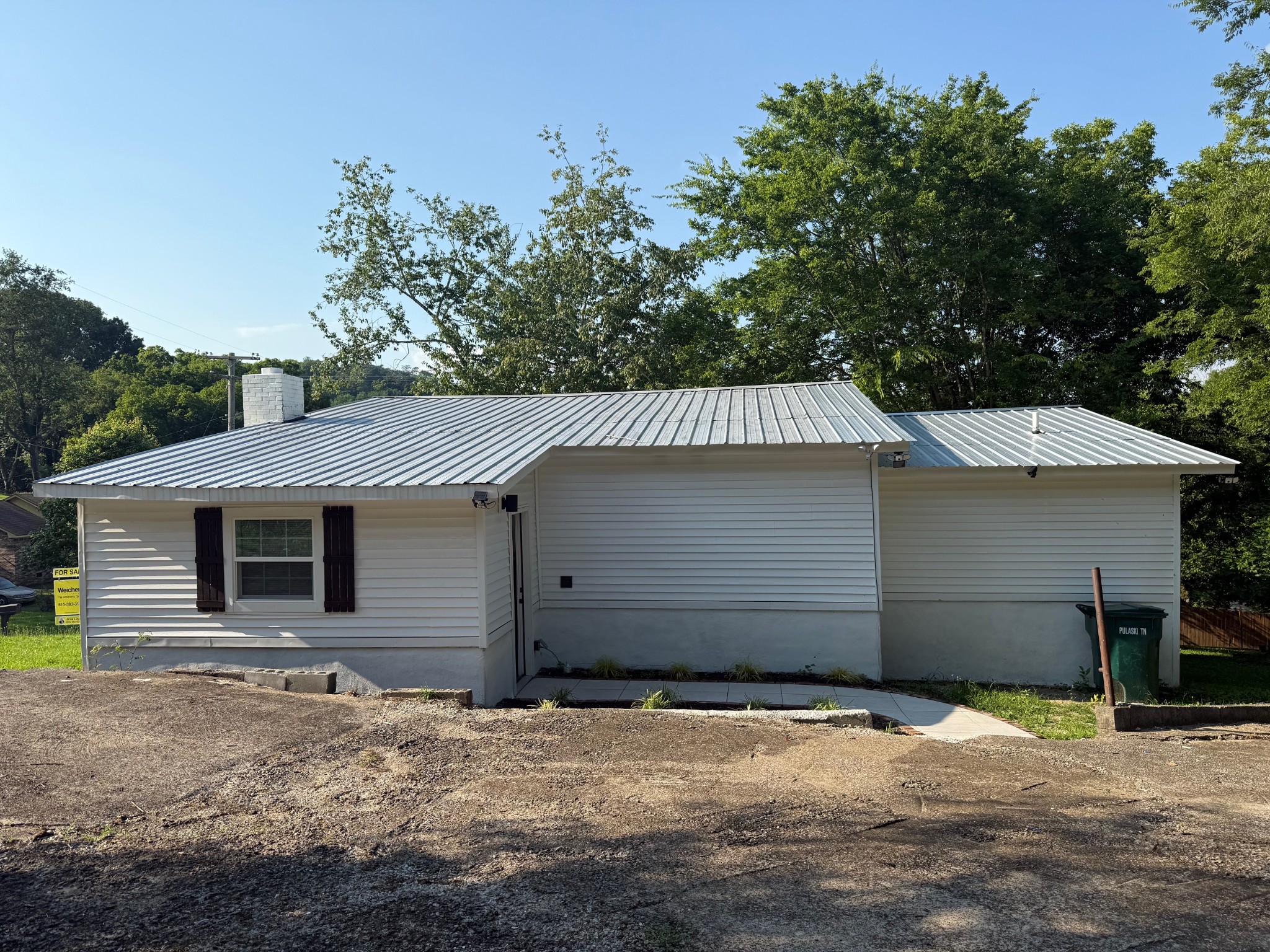 140 Phillips Street Pulaski, TN 38478 - Photo 22 of 32 a front view of a house with a yard