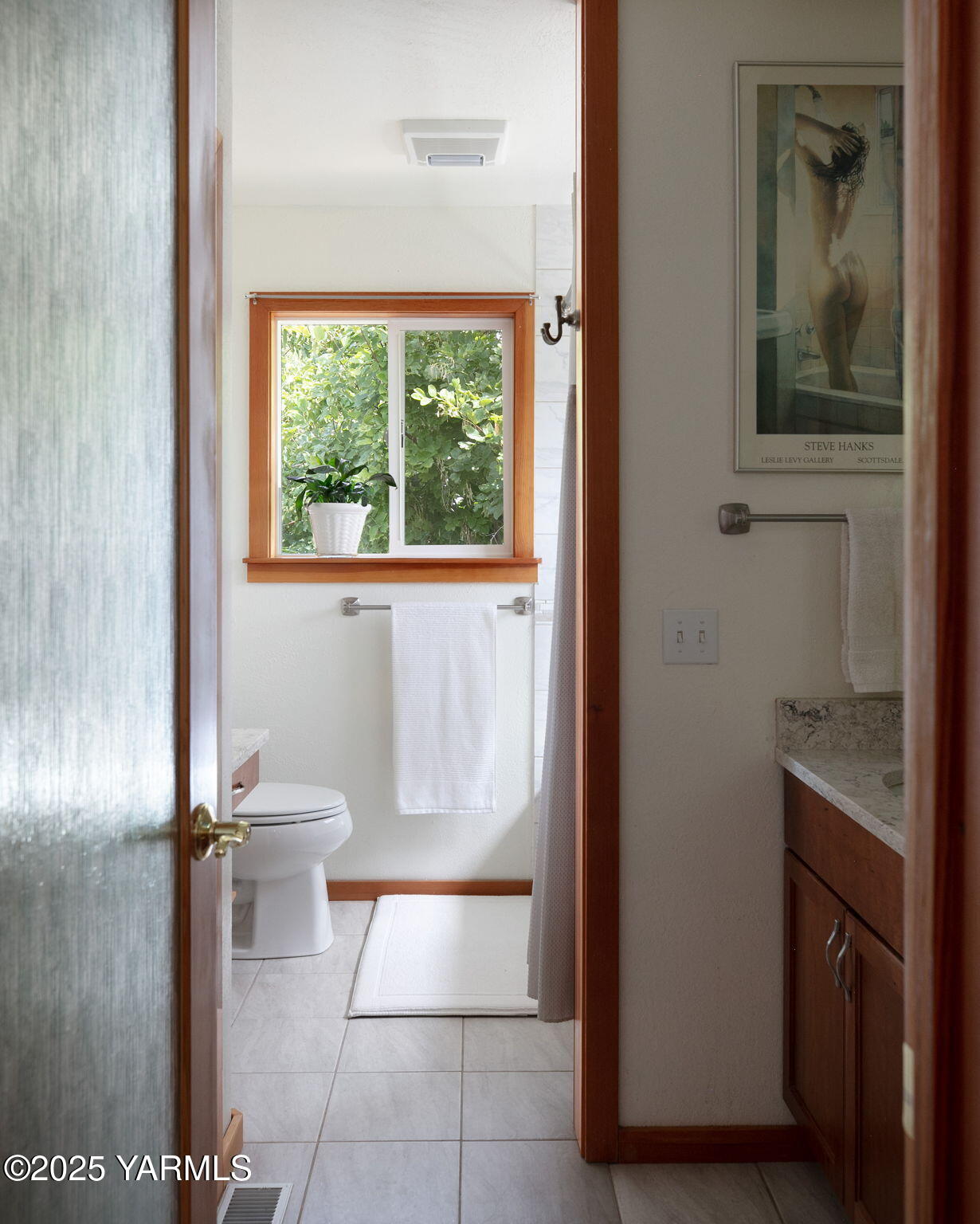 720 Ghormley Road Yakima, WA 98908 - Photo 34 of 47 a bathroom with a granite countertop sink a mirror and a toilet