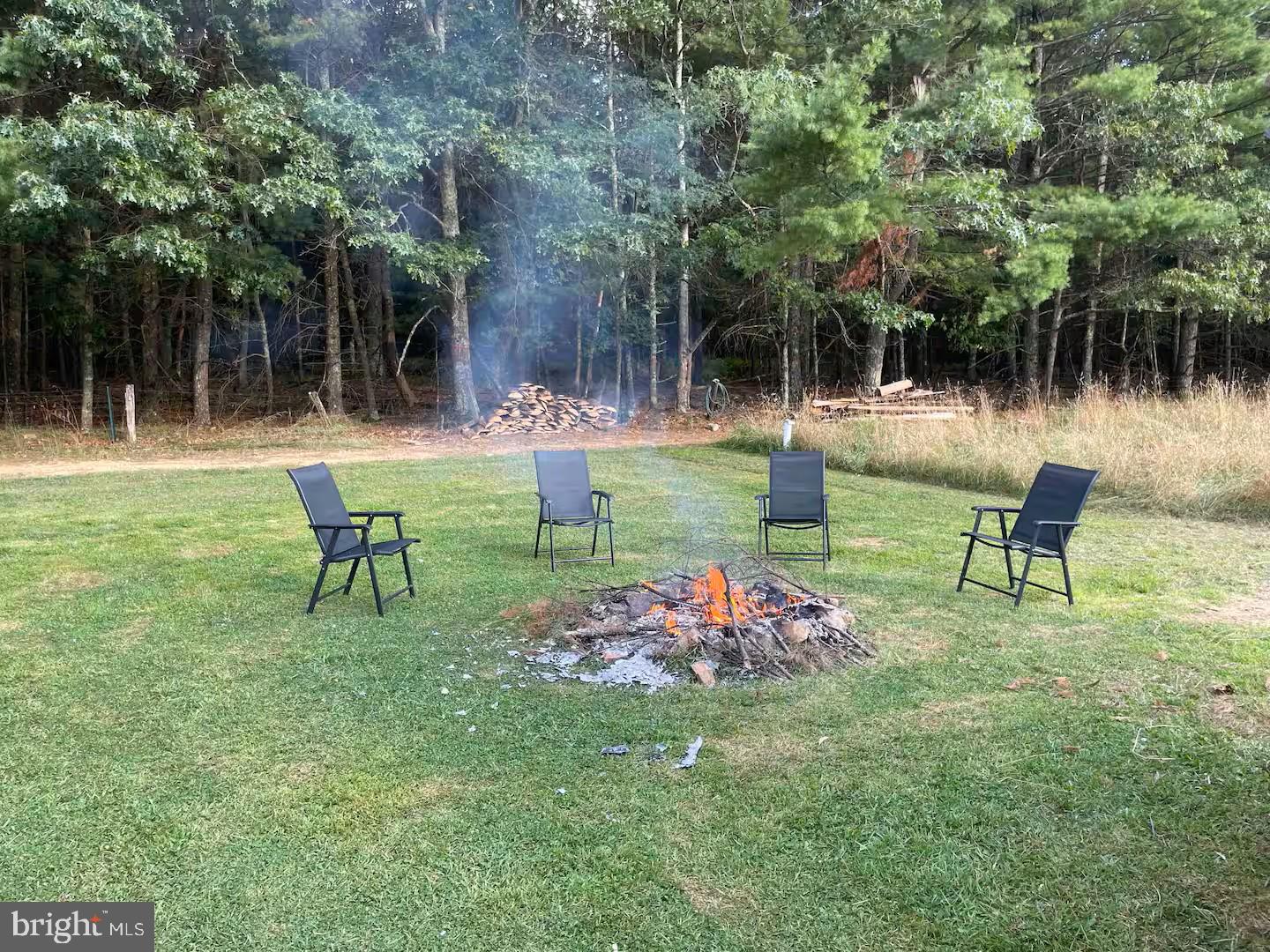 184 Skiles- Pitsenbarger Road Franklin, WV 26807 - Photo 24 of 39 Cozy campfire gathering spot.