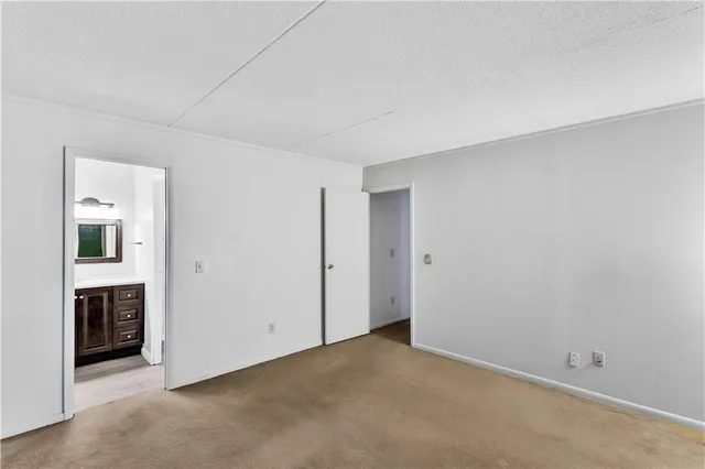 a bathroom with a shower sink and mirror