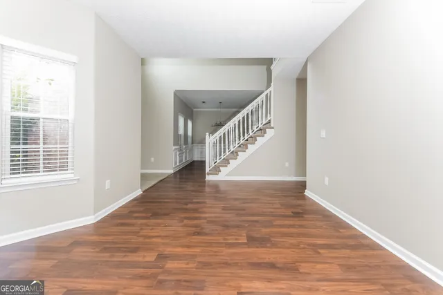 a view of an entryway with wooden floor