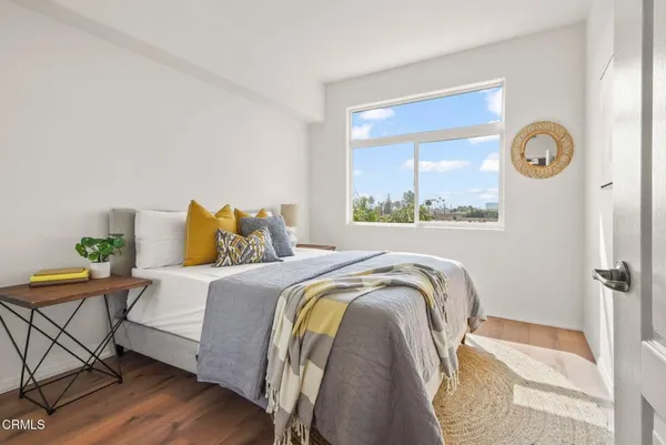 a bedroom with a bed and a view of bedroom