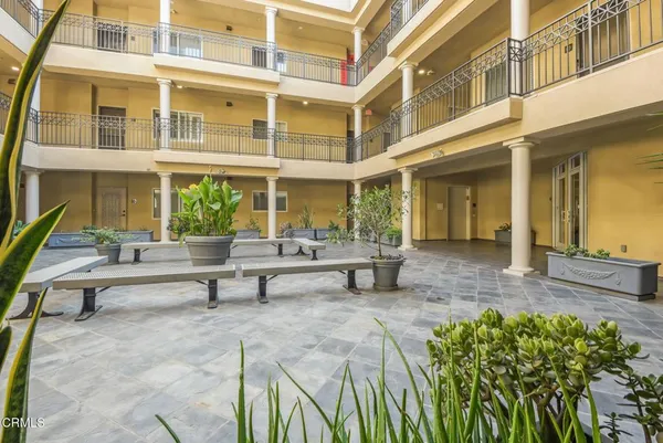 a view of a building with sitting area