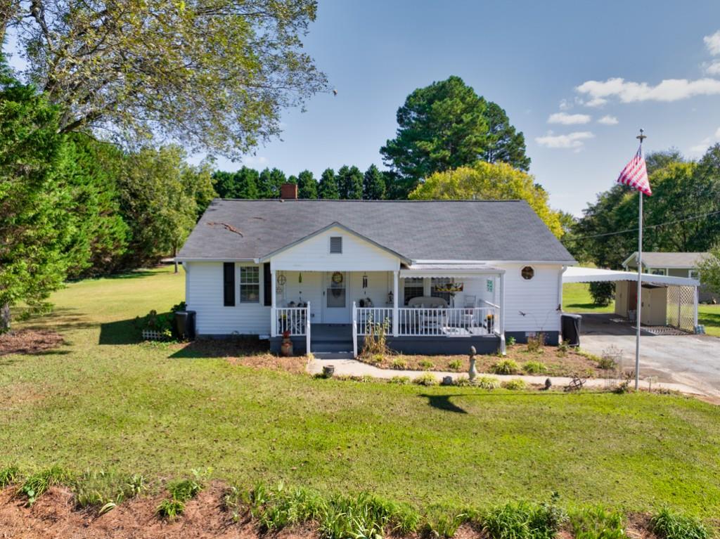 a swimming pool covered with tall trees