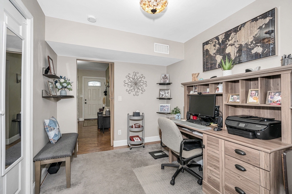 63 Jasper Street Saugus, MA 01906 - Photo 13 of 22 a view of a workspace with furniture and a livingroom