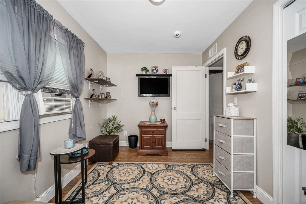 63 Jasper Street Saugus, MA 01906 - Photo 15 of 22 a living room with furniture and a flat screen tv