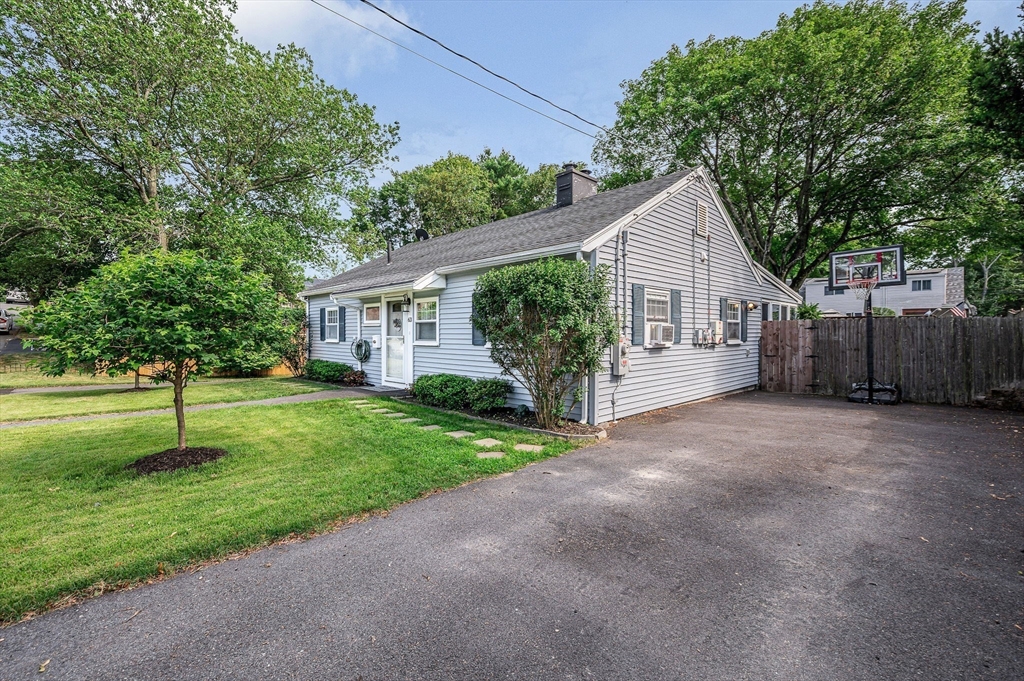 63 Jasper Street Saugus, MA 01906 - Photo 2 of 22 a view of a house with a yard and plants