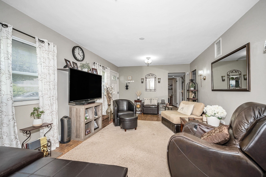 63 Jasper Street Saugus, MA 01906 - Photo 5 of 22 a living room with furniture and a flat screen tv