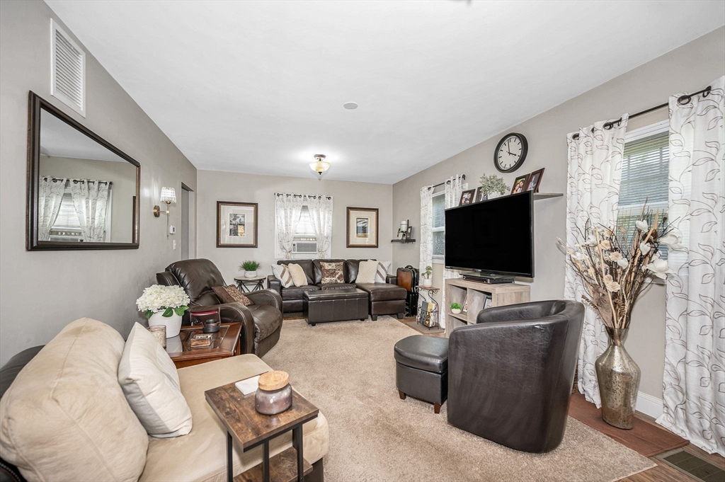 63 Jasper Street Saugus, MA 01906 - Photo 7 of 22 a living room with furniture and a flat screen tv