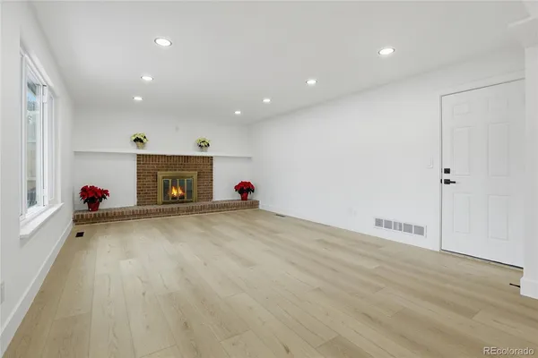 a very nice looking room with a fireplace and a window