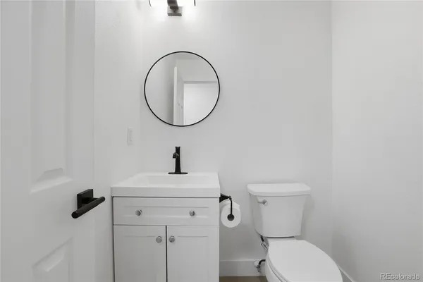 a bathroom with a toilet and a sink