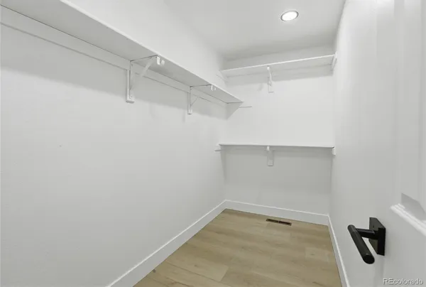 a view of a room with racks on the wall