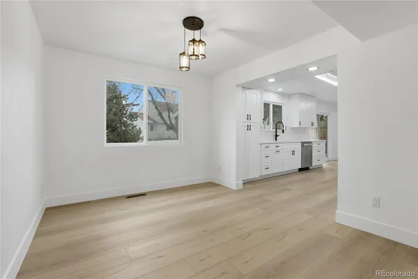 a view of a livingroom with a kitchen