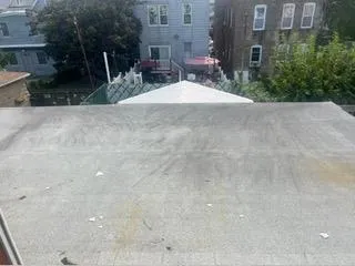 a view of a chairs and table in a patio