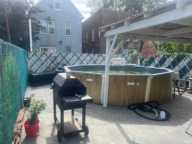 a view of a porch with chairs and a potted plant