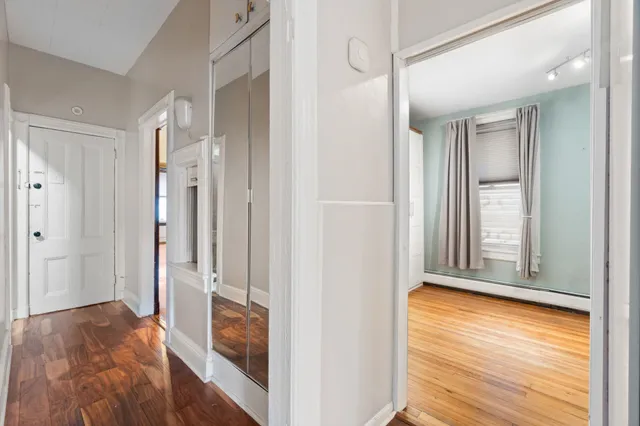 a view of a bathroom from a hallway