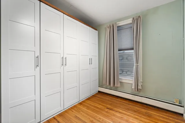 a view of front door with wooden floor