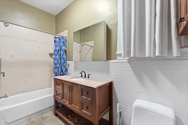 a bathroom with a sink a toilet and a bathtub