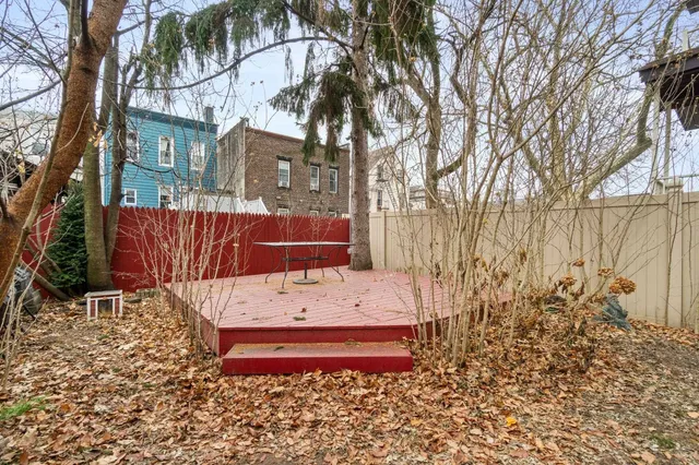 a view of a bench in a backyard